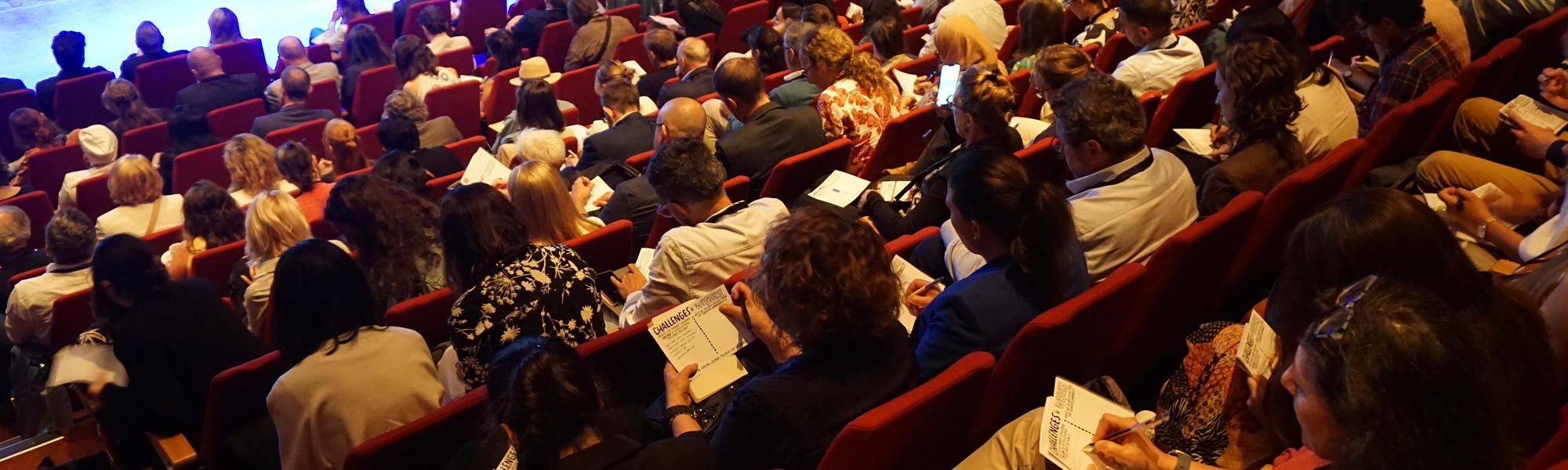 A group of people watching a session
